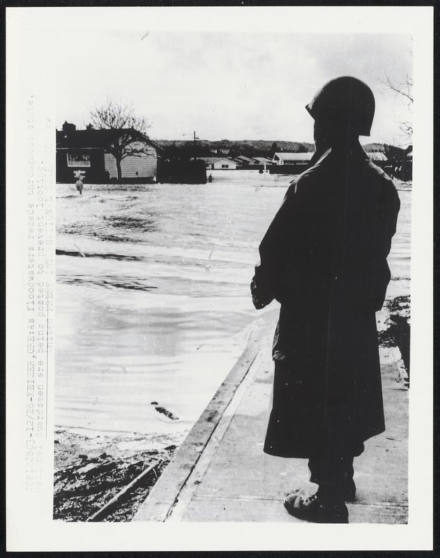 As floodwaters recede throughout state, National Guardsmen are being posted to prevent looting.