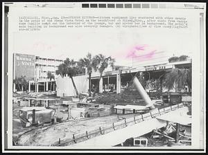 Outdoor Kitchen--Kitchen equipment lies scattered with other debris on the patio of the Buena Vista Motel on the beachfront at Biloxi, Miss., after winds from Hurricane Camille swept out the interior of the lounge, bar and oyster bar in background. The motel's main building in background was also severely damaged.