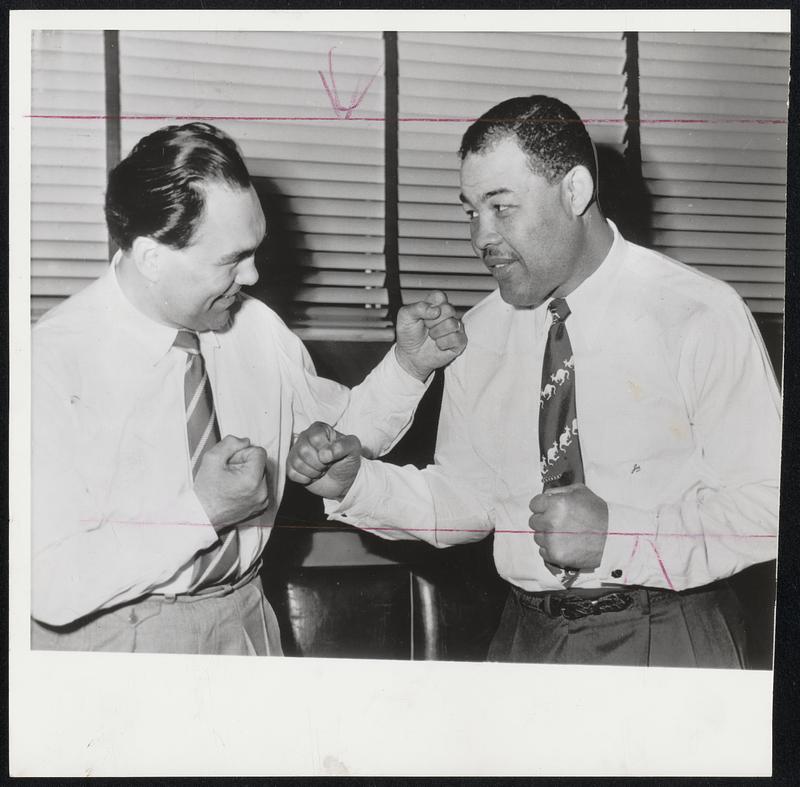 Old Warriors Meet Again - Two former World's heavyweight boxing champions square off as they meet for the first time in 16 years. It's 48-year-old Max Schmeling (left) of Germany and 39-year-old Joe Louis whose smiling moods are a far cry from their last meeting when Louis flattened Schmeling in 1938.