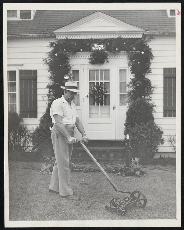 Lawn-Mowing Weather in Maine-Oscar Cram of Augusta, Me., observes the early stages of the New Year by mowing his lawn in shirt sleeves. Maine, usually noted for its rugged winters, has had virtually no snow and little cold weather so far this season.