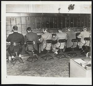 Man the Boards - Male supervisors of the Indiana Bell Telephone Company in Indianapolis, Ind., took over operation of the long distance boards after the women operators refused to go through a picket line of CIO maintenance workers. Here's a view of the men at work.