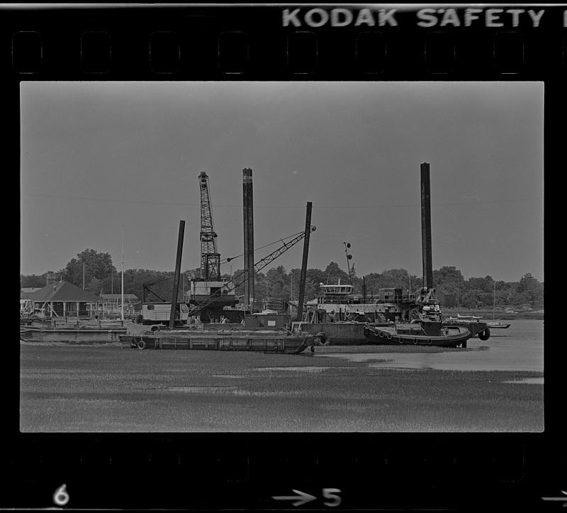 Water Street seawall, barges, and marsh