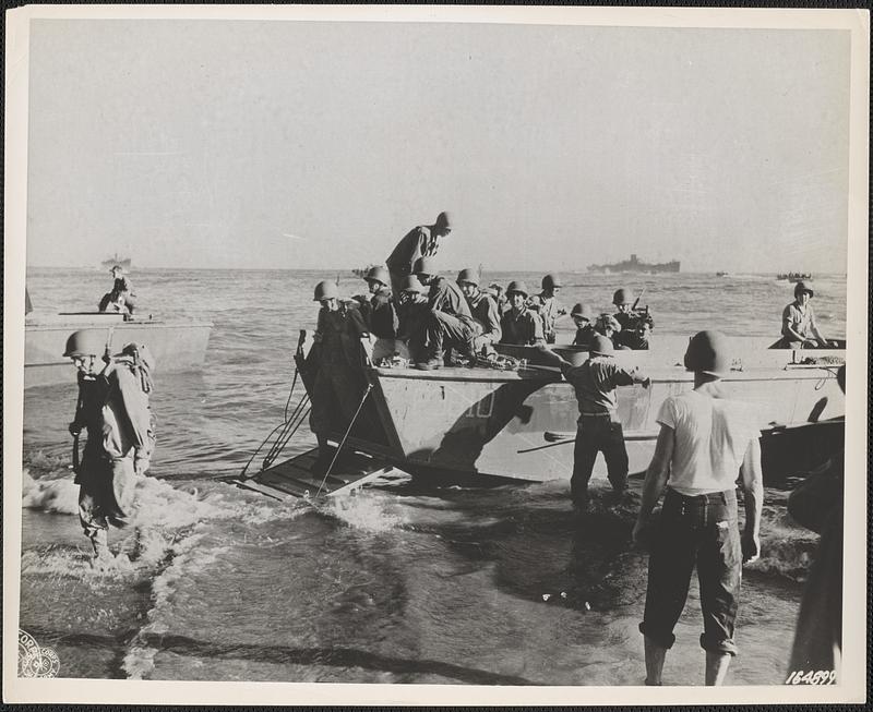 Troops of Americal Division land on beach of Guadalcanal without enemy ...