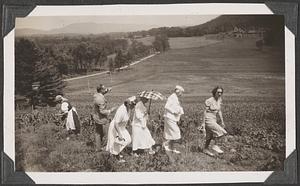 A group of people going up a hill