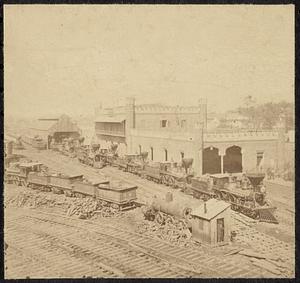 Railroad yard and depot with locomotives; the Capitol in distance. Nashville, Tenn.