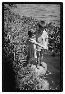 Children by a body of water