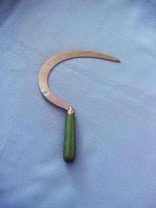 Green painted ceremonial sickle