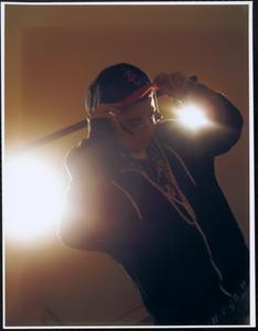 Backlit boy in sweatshirt