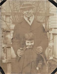 Unidentified man with young girl