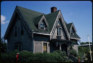 Gray house with green roof and gables with openwork decoration, Roxbury, Boston