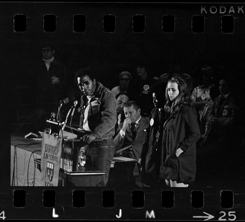 HEW [Health, Education and Welfare] Secretary Robert Finch pre-empted by housing-for-poor demonstrators, Harvard (Sanders Theatre)