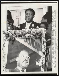 Rev. Ralph Abernathy stands near the spot where Dr. Martin Luther King was slain last year. A brief service was held prior to the start of a memorial march 4/4.