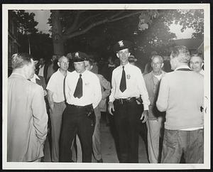 Dighton Police And Strikers – Acting Chief Wilbur Menges (right in white shirt) and unidentified officer mingle with strikers outside the Mt. Hope Finishing Company after Menges pleaded for cessation of violence that rocked Dighton Tuesday.