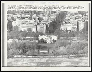 A solid wall of busses lined up bumper to bumper as a barricade to surround the White House 11/15 during the peace march. The mammoth demonstration went off without trouble but extremist war protesters clashed with police near the Justice Department following the peace march.