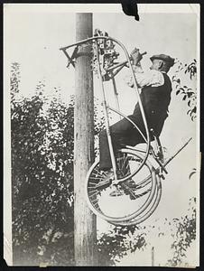 Here's a Wonder Bicycle That Climbs, and Can be Turned Into Boat. Here's one to marvel over. You start out with a bicycle, so constructed, that if you should suddenly decide to climb a telegraph pole, it will be alright, for your machine can do it gracefully, and if you want to go out for a little row, what's going to stop you. You have the boat right with you. The bicycle frame can be turned into a boat by simply spreading a strip of canvas over it and attaching it to fastening posts. And here we do the monkey act and climb a tree.