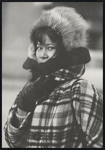 Woman in coat and fur hat