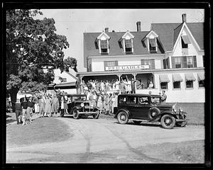 A group of people posing in front of "Red Gables"