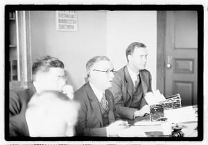 Group of men at table
