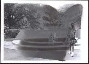 Young people sitting outside on circular steps