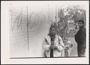 Two boys wearing jackets outside