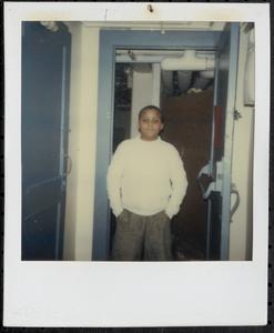 Boy posing with hands in pockets