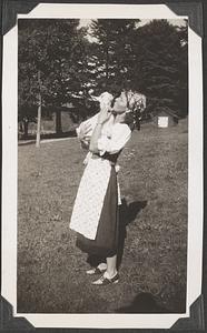 A woman holding a goat