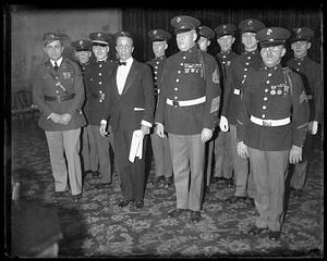 A group of unidentified men, most in military uniform