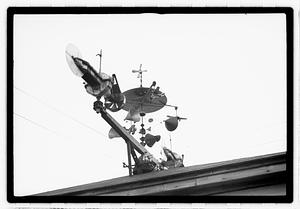 An elaborate device on roof, possibly a weather vane