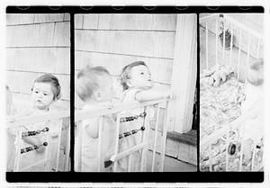 Two children in a playpen