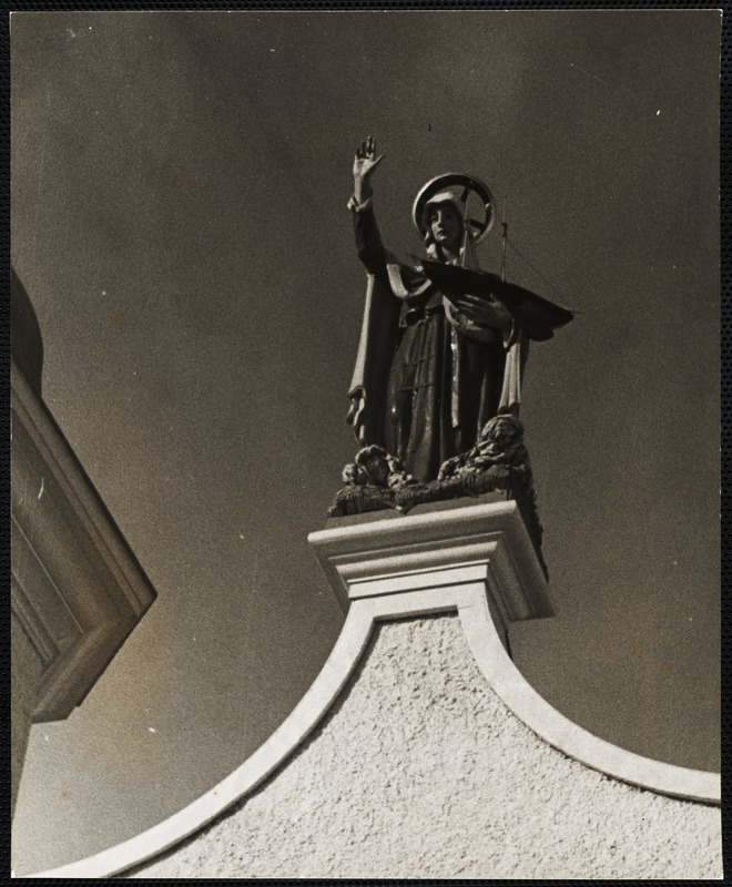 Madonna holding a fishing schooner in one hand - Church of Our Lady of Good Voyage Gloucester, Mass.