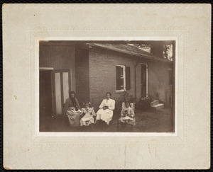 4 females sitting in front of Martha Mattoon's house