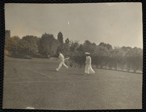 Man & woman playing tennis