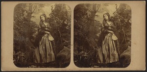 Woman wearing mantilla with fan