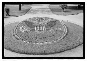 "1787-1937" floral design of the Great Seal of the United States in front of Ether Monument, Public Garden