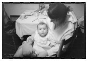 Maude Sanromá holding a baby on her lap