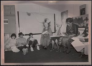 Group of people sitting and reading