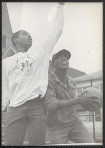 Donovan Thomas and Omo Moses playing basketball