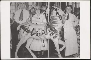 3 patrons with carousel horse