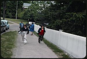 Children running down sidewalk, Stockbridge, Massachusetts