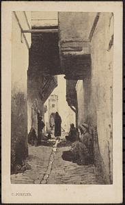 People sitting on the sides of an unidentified alley