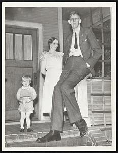 Mother’s Big Boy -- Robert Wadlow of Alton, Ill., was 17 years old Feb. 22. His height is 8 feet 2½ in., and he weighs 385 pounds -- and he’s still growing. He is shown here with his mother and one of his two brothers. His family are of normal size.