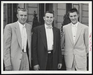 Youthful Tiger Trio arrive in Boston for tonight's game with the Red Sox at Fenway Park. Left to right are Shortstop Harvey Kuenn, and Pitchers Bob Miller and Billy Hoeft.