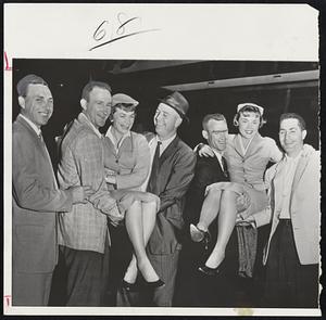 Joyous Dodgers arrived in Chicago last night after winning the National League flag by downing Braves in two consecutive playoff games. The Dodgers are, left to right, Gil Hodges, Roger Craig, Manager Walt Alston, Wally Moon and Carl Furillo. Airline stewardesses getting a lift are Redo Payne, left, and Shirly Aden.
