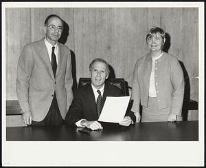 Kevin White, seated, with two unidentified people