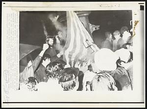 Italians Demonstrate Against U.S. - Screaming demonstrators set afire a U.S. flag Wednesday at the end of an anti-American rally near the U.S. embassy in Rome. It was estimated that at one point nearly 10,000 persons jammed a street leading to the embassy building.