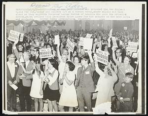 Some of the 3000 persons who attended the New England Rally For God, Family and Country 7/5 at a Boston Hotel, cheer wildly and wave signs as they applaud Governor Lester Maddox of Georgia who gave the principal speech, which praised Vice President Spiro Agnew for his attacks on the news media and students.