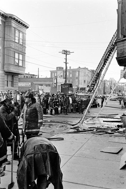 Left to right, standing, firefighter John O'Driscoll and Lt. Adolf Spinazolla