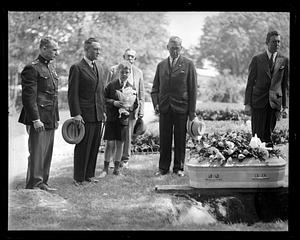 People standing by a coffin including Richard E. Byrd
