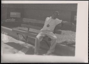 Young man sitting on a bench