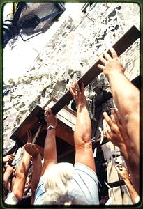 Boston 1981: As confetti comes down, bearers raise a statue of St. Anthony during St. Anthony's Feast, N. End